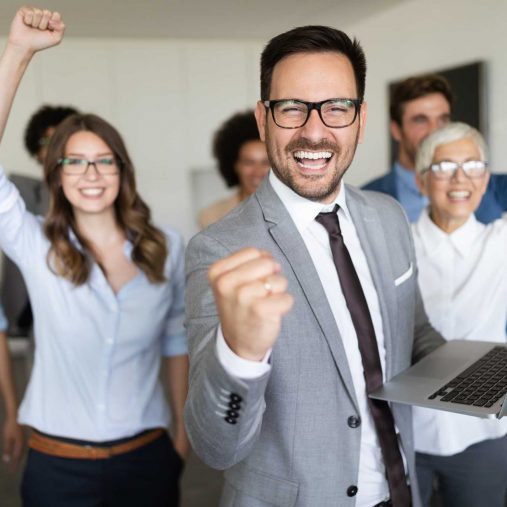 Group of people celebrating a victory with hand gestures